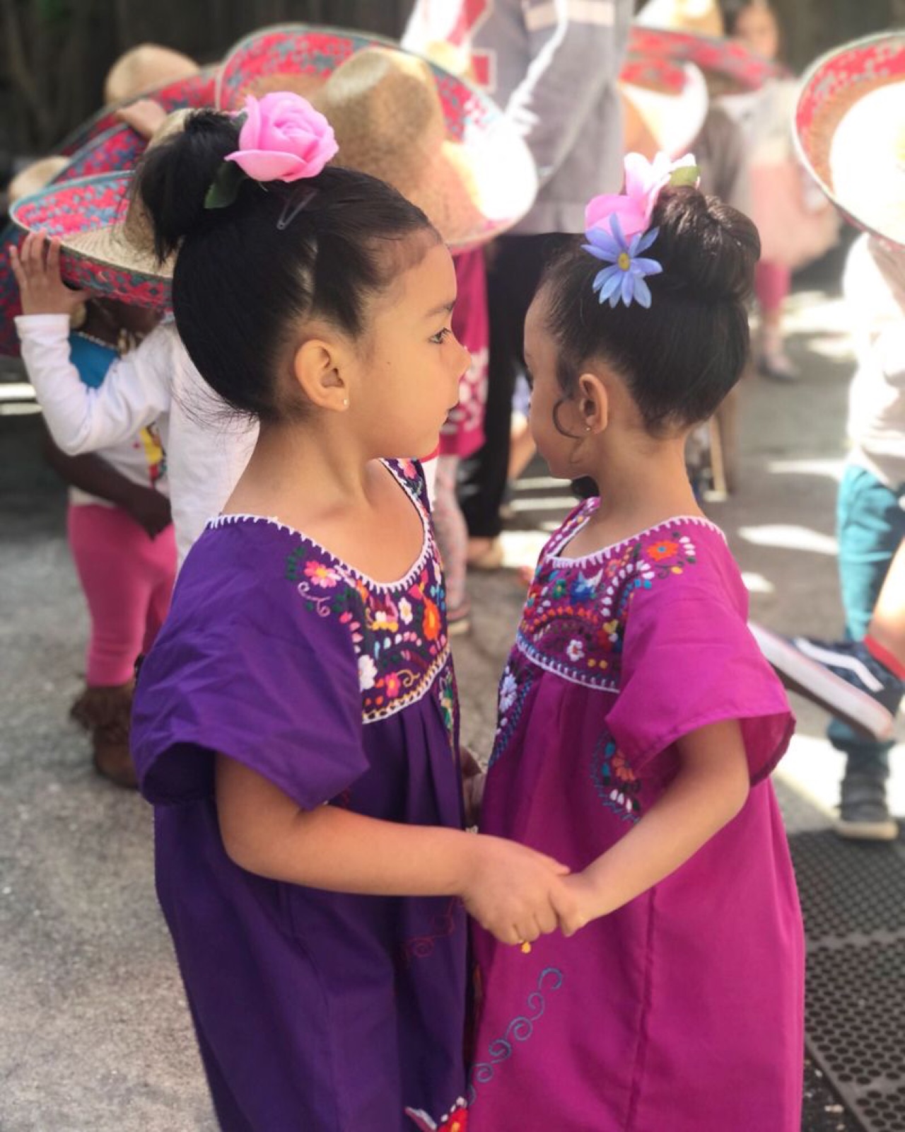 Traditional dresses and held hands at our Cinco de Mayo fiesta